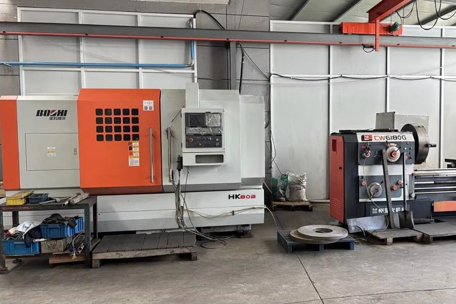 CNC lathe equipment shown in the factory photograph