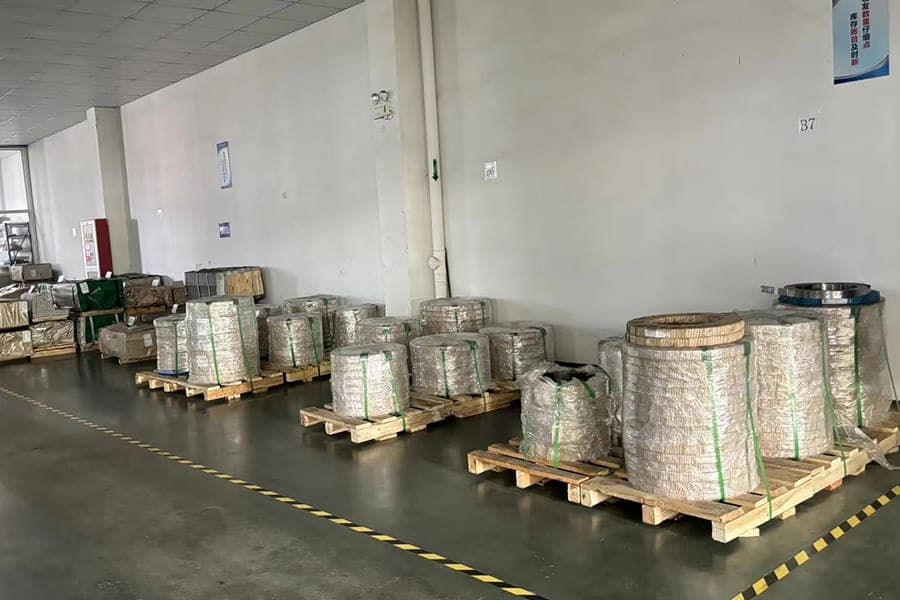 Metal coils and strip material stored on pallets